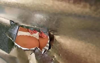 Peeking Through The Hole In The Wall At The Beach Cabin