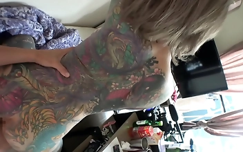 Revealing The Ideal Female Figure: A Tattooed Enchantress Strips Off Her Clothes,